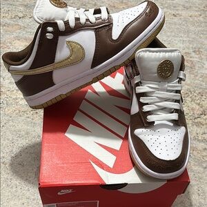 Nike White and Brown Sneakers with Gold Swoosh